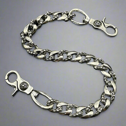 Silver chain with clasp on a black background