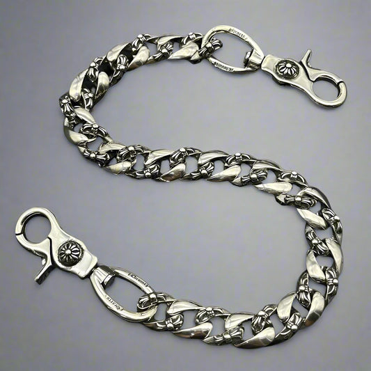 Silver chain with clasp on a black background