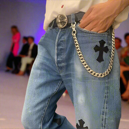 Silver chain with clasp on a black background with clasp for pants